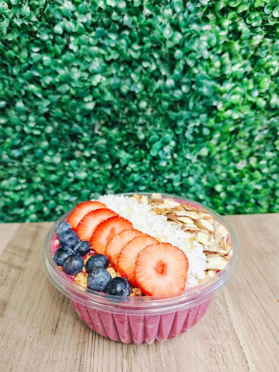 Acai bowl topped with strawberries, blueberries and banana